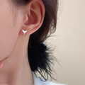 Women's fashion earrings with fishtail design in copper with gold colour finishes