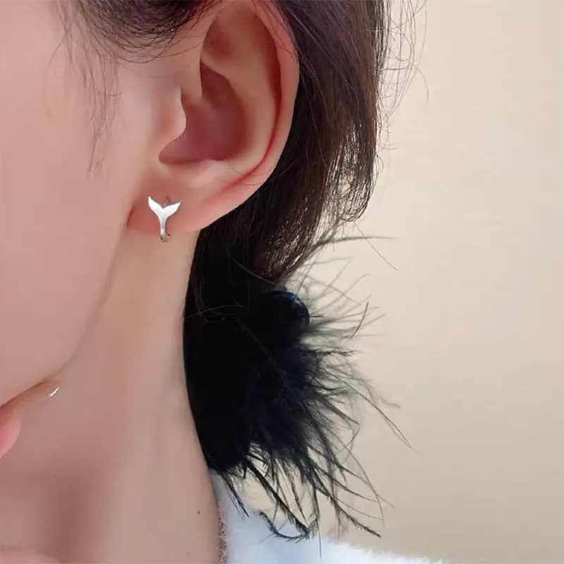 Women's fashion earrings with fishtail design in copper with gold colour finishes