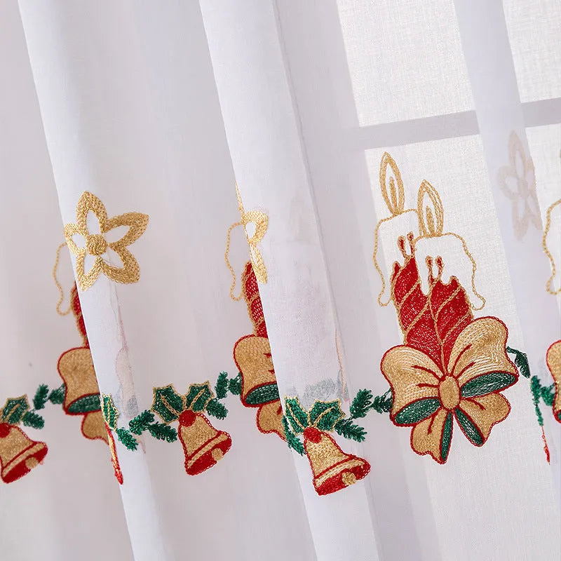 A pair of white polyester curtains with embroidered red Christmas snowflakes in an American style.