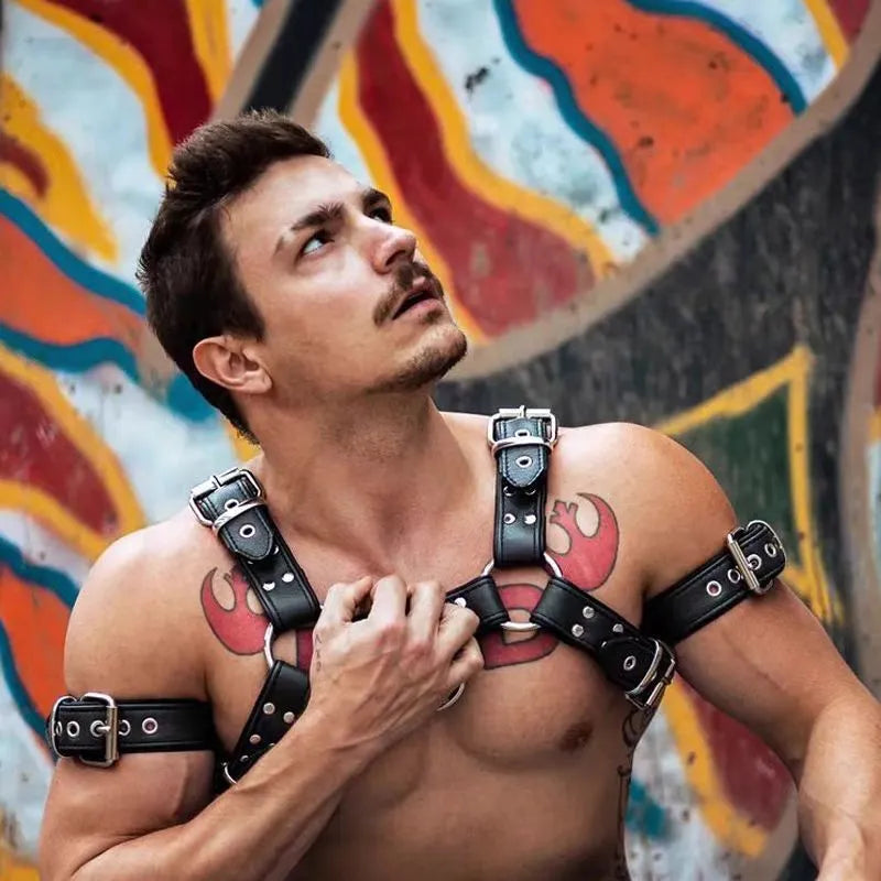 Black leather chest harness with adjustable shoulder straps and metal buckle fastenings