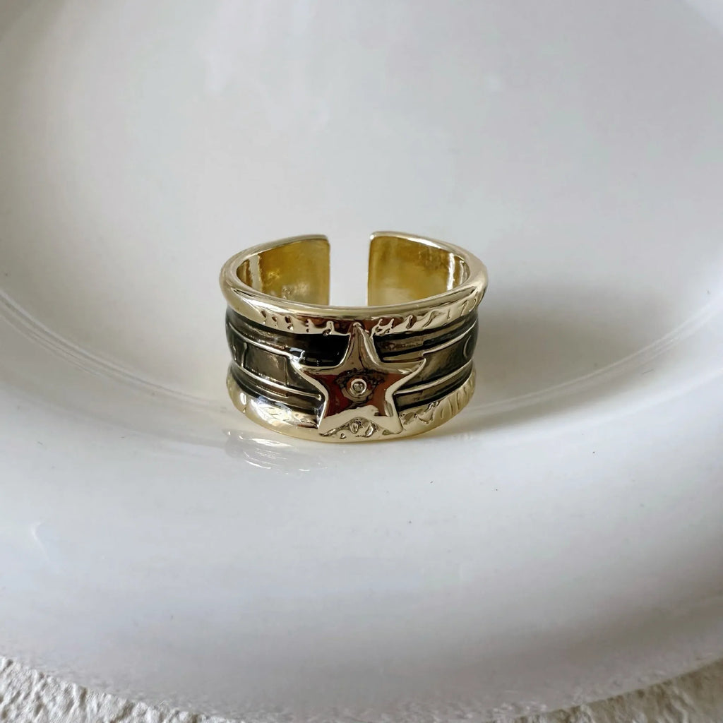 Adjustable copper ring with retro distressed geometry design and lines pattern.