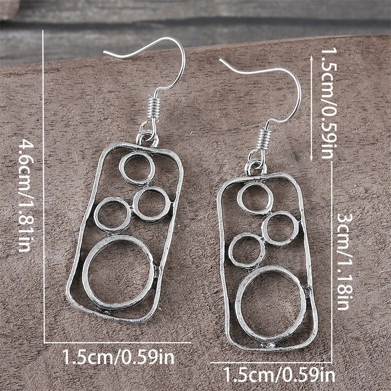 Round geometric earrings with irregular square designs in antique silver finish