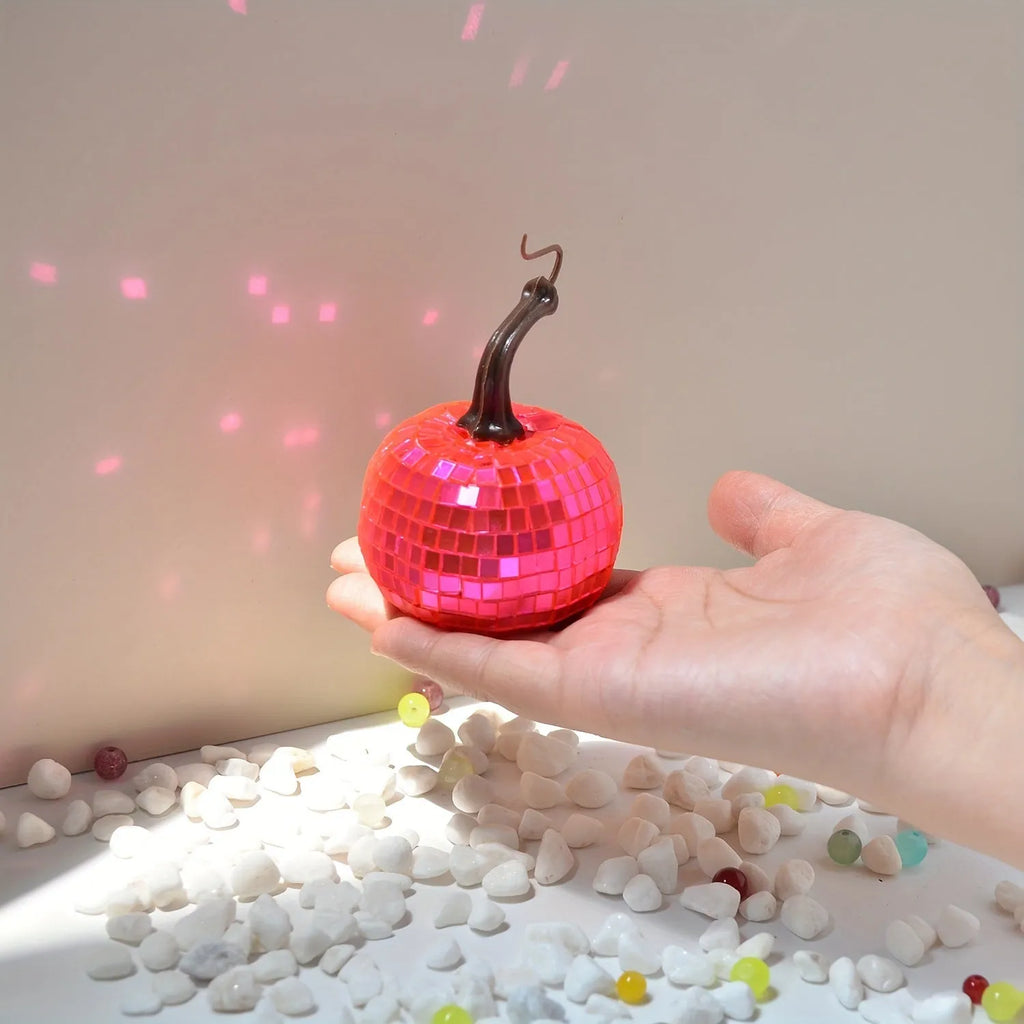 A detailed glass pumpkin decoration with embroidered finish, shown in multiple sizes for Halloween and Christmas.