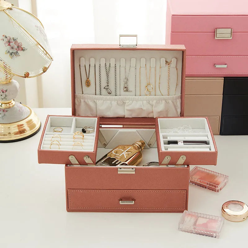 Hard case PU leather jewellery storage box in rose gold colour with dimensions 22.5cm by 15.5cm.