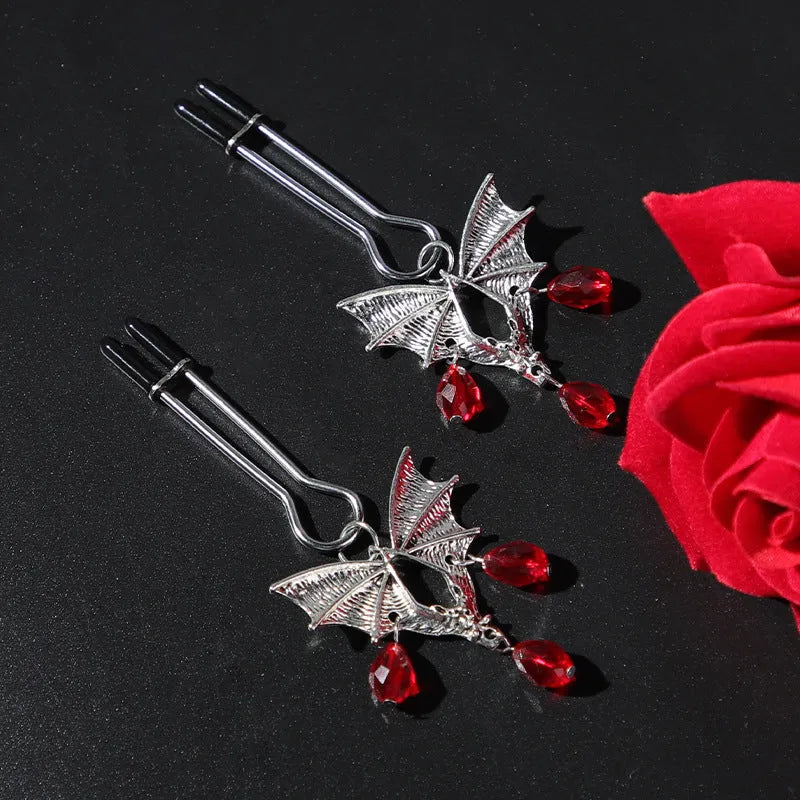 Silver alloy adjustable bat nipple clamp with screw mechanism on white background