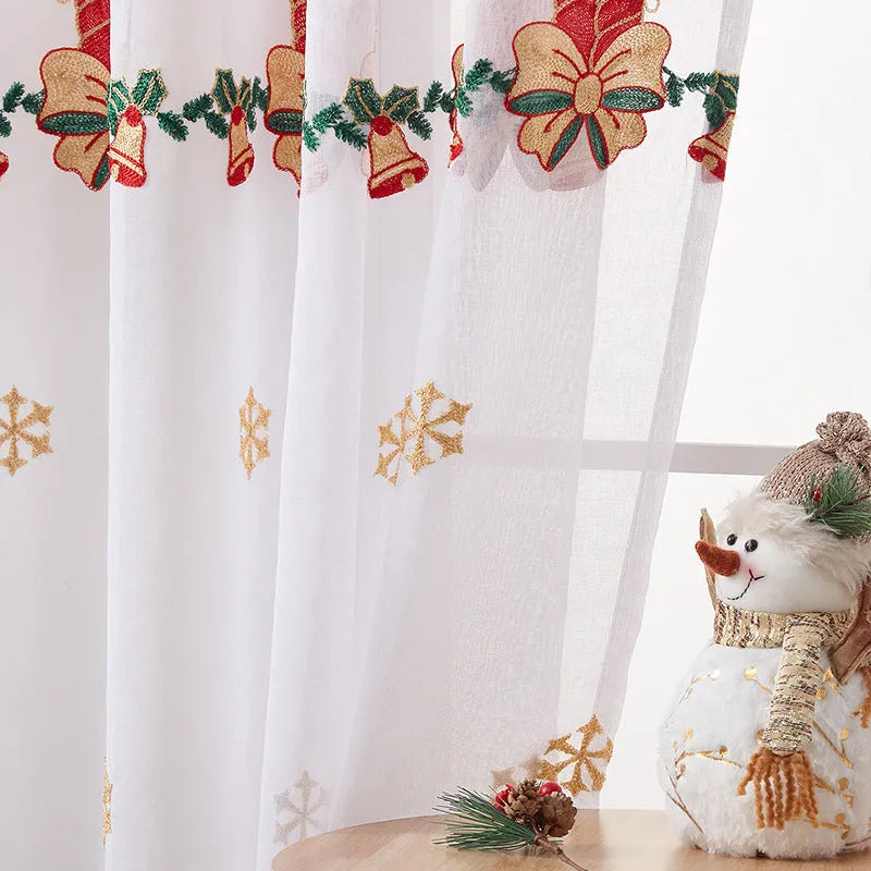 A pair of white polyester curtains with embroidered red Christmas snowflakes in an American style.