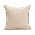 Solid colour decorative cushion on a sofa, showing its square shape and pp cotton filling.