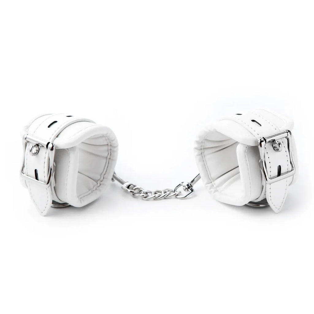 White PU sponge bondage set showing handcuffs, footcuffs and neck scarf for comfortable restraint accessories