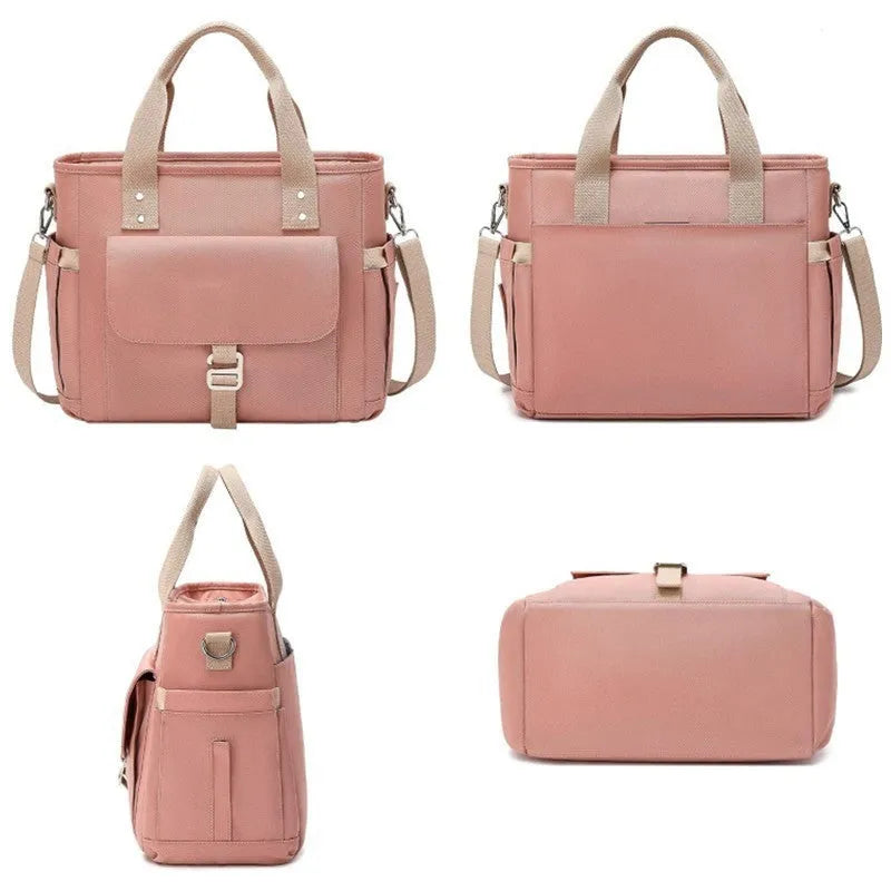 Portable cube-style picnic bag with removable shoulder strap in black, green, or pink colour options