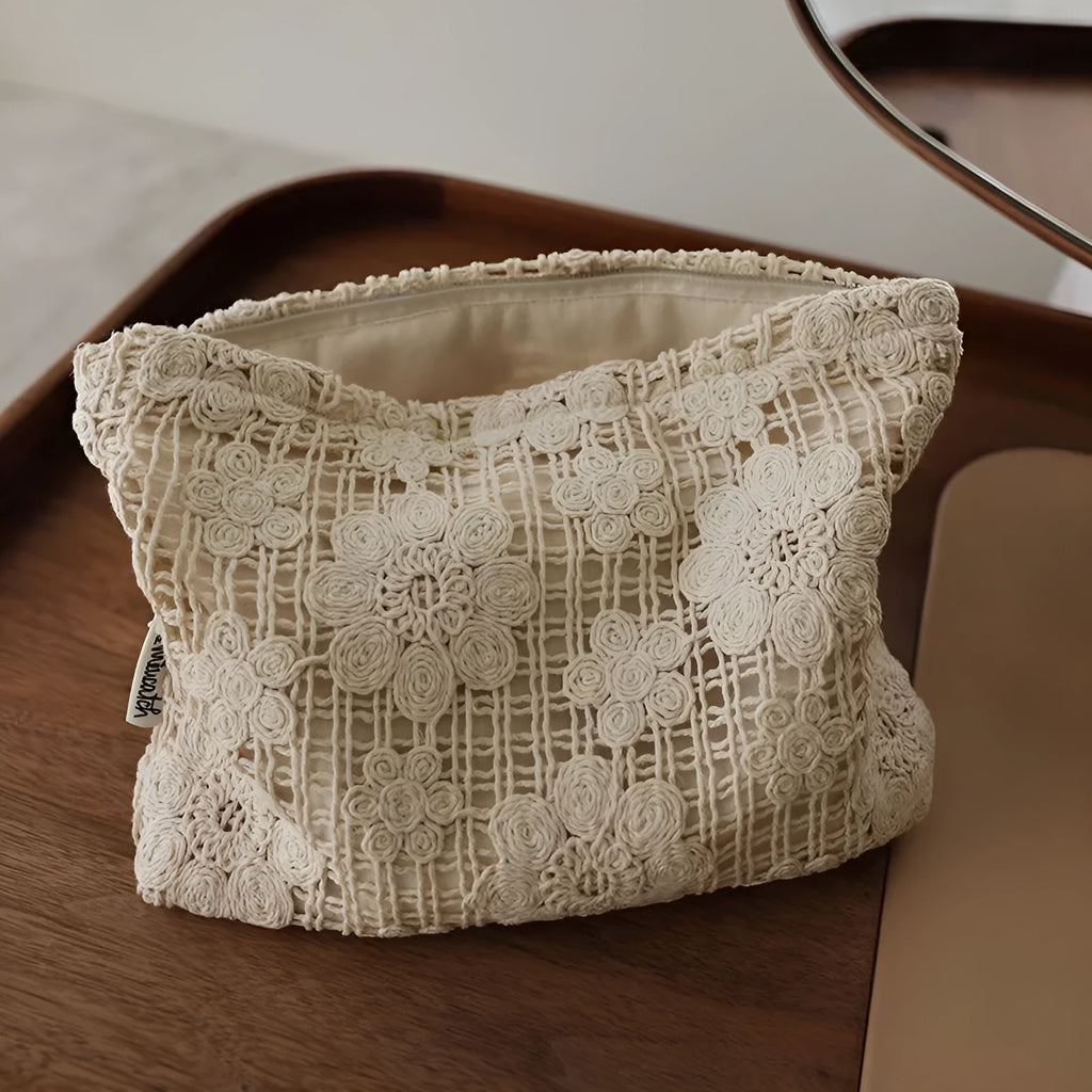 Handmade crocheted hollow flower cosmetic bag with ethnic embroidery patterns on corduroy fabric