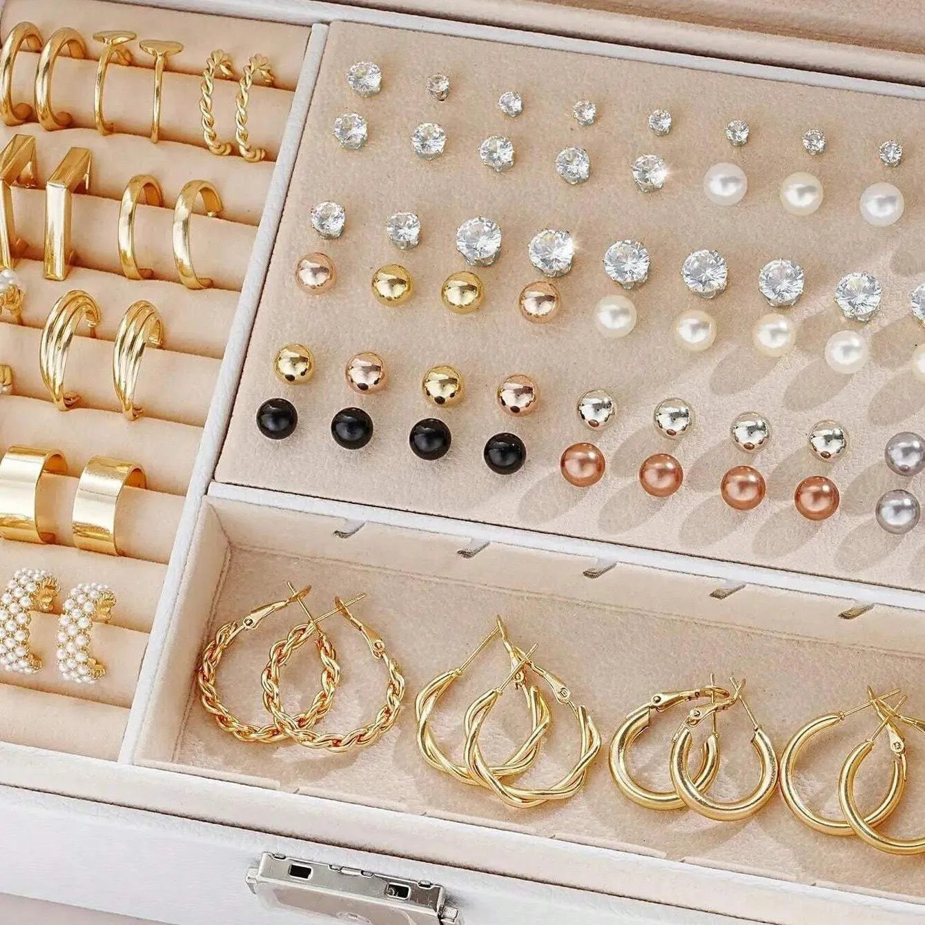 108 geometric round pearl earrings in gold and yellow electroplated alloy finishes displayed as a collection