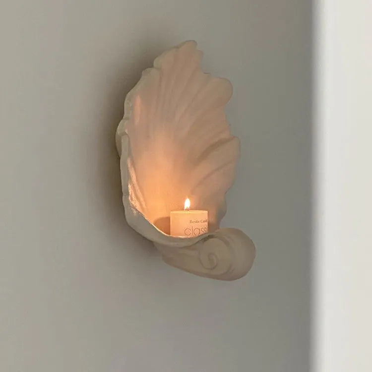 White resin simulation shell storage fruit plate ornament on a plain background.