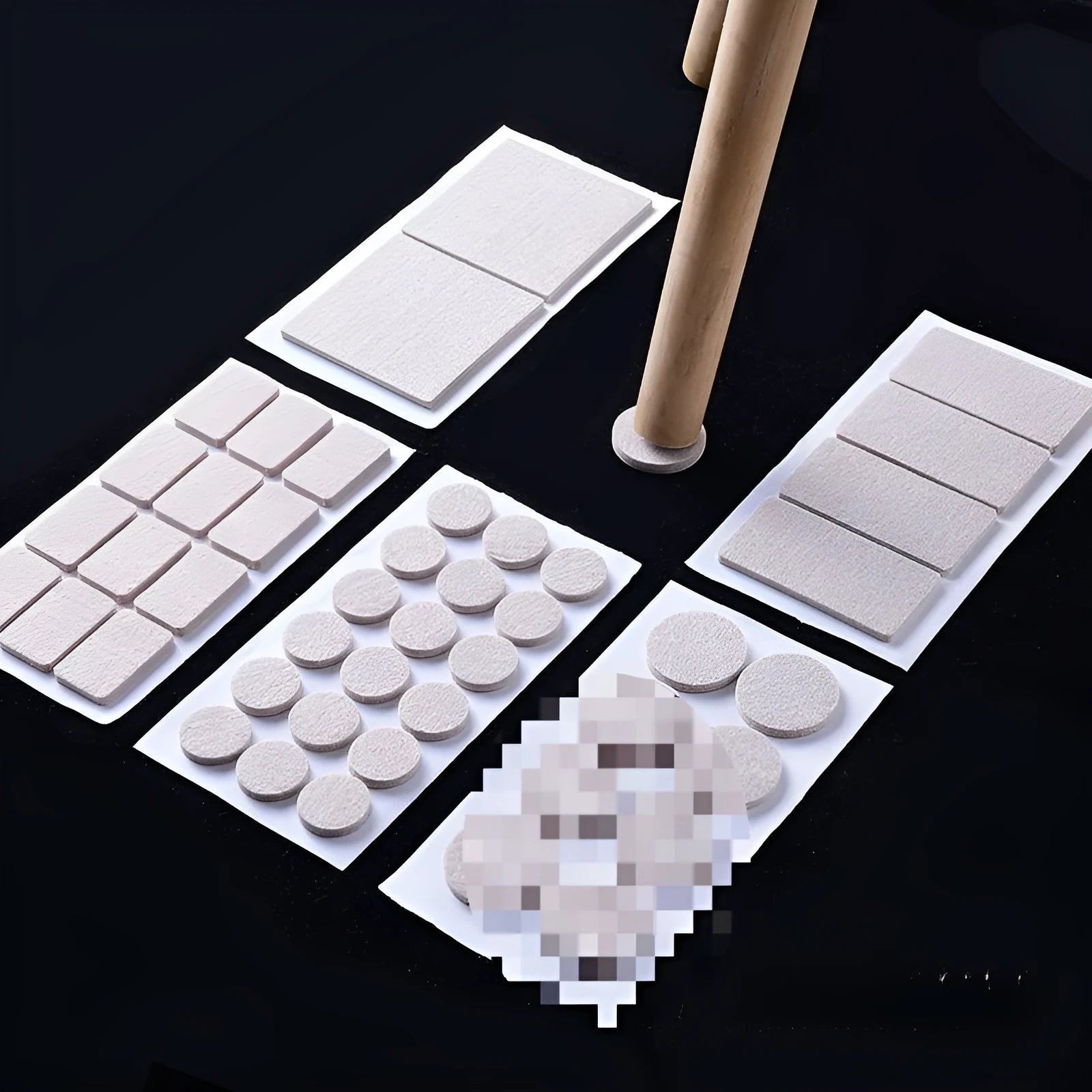 Beige plastic furniture leg protection pads in round and square shapes on wooden floor