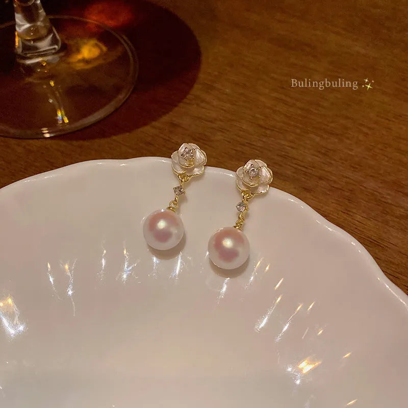 Camellia flower stud earrings with pearl detail in alloy metal for women