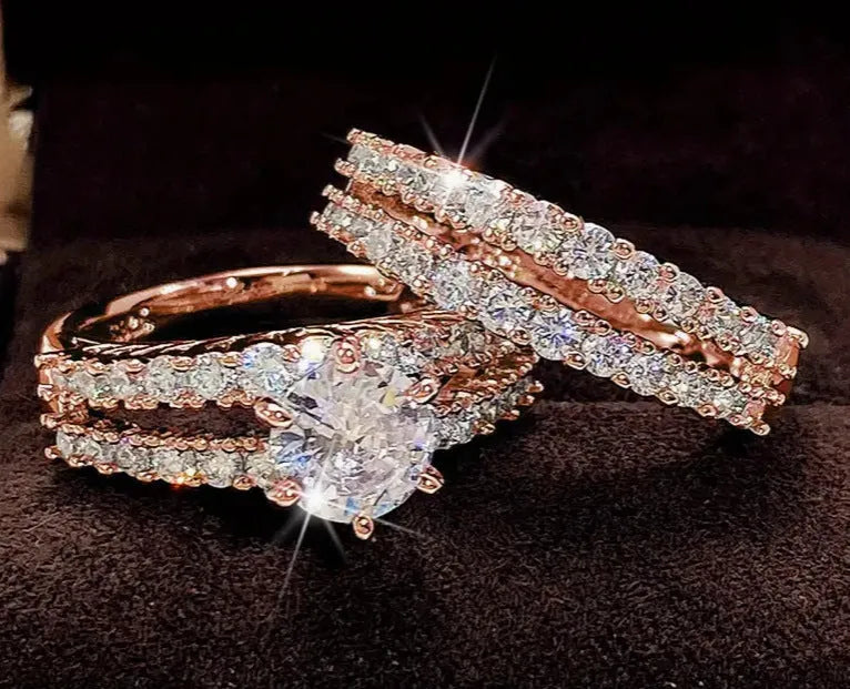 Two interchangeable geometric fashion rings with fully-jewelled round elements in gold, rose gold or silver colours