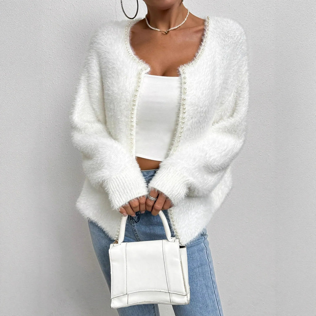 White women's V-neck cardigan sweater with medium thickness and standard length