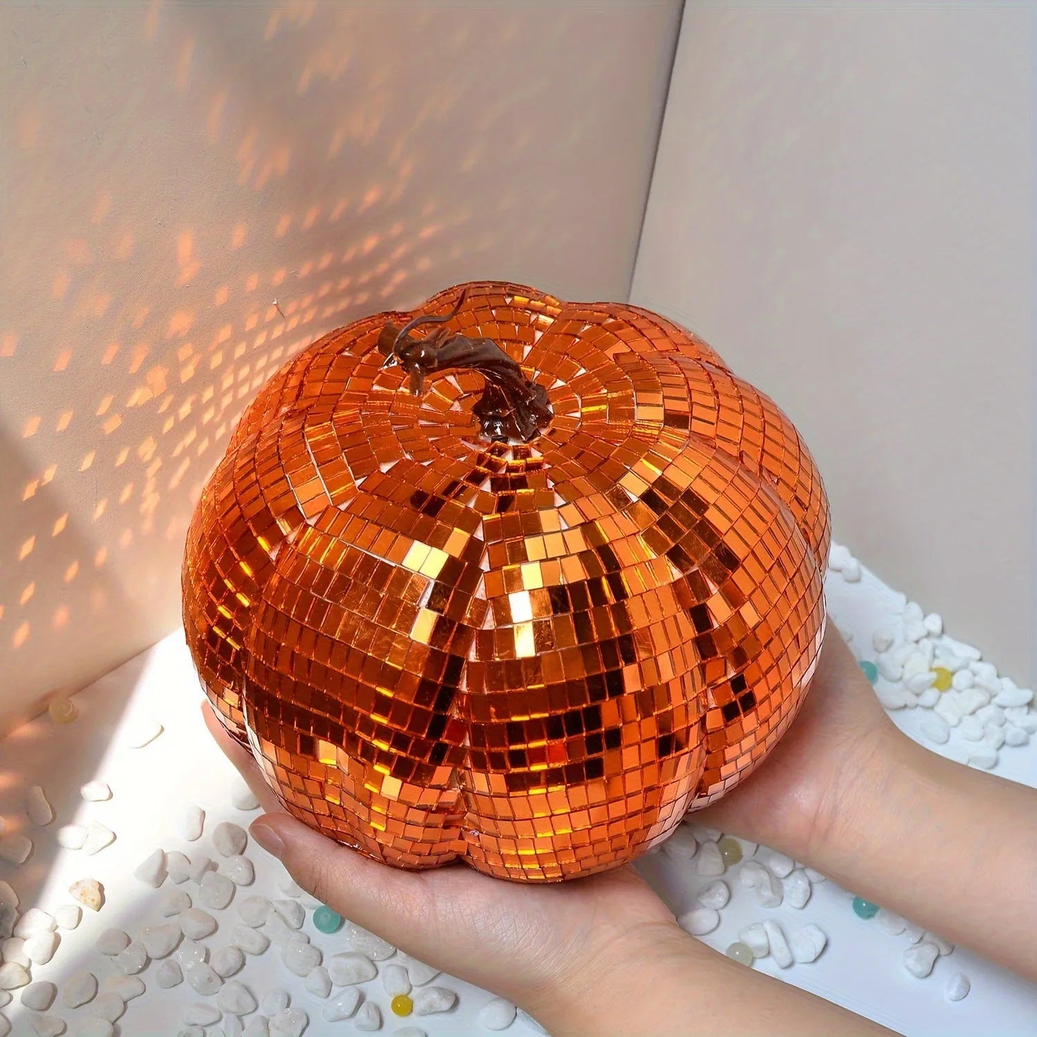 A detailed glass pumpkin decoration with embroidered finish, shown in multiple sizes for Halloween and Christmas.