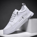 Men's black and white low-top skate shoes with elastic band and rubber soles