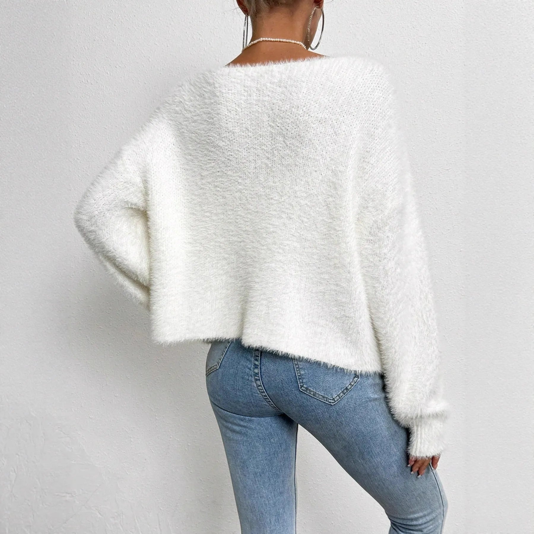 White women's V-neck cardigan sweater with medium thickness and standard length