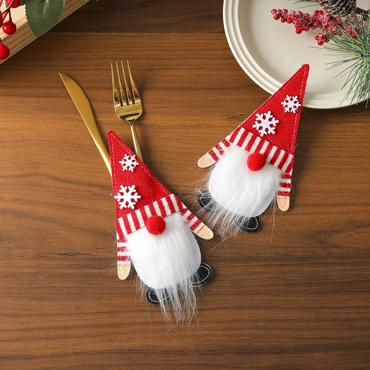 Christmas knife and fork cloth cover in snowflake style on a dining table
