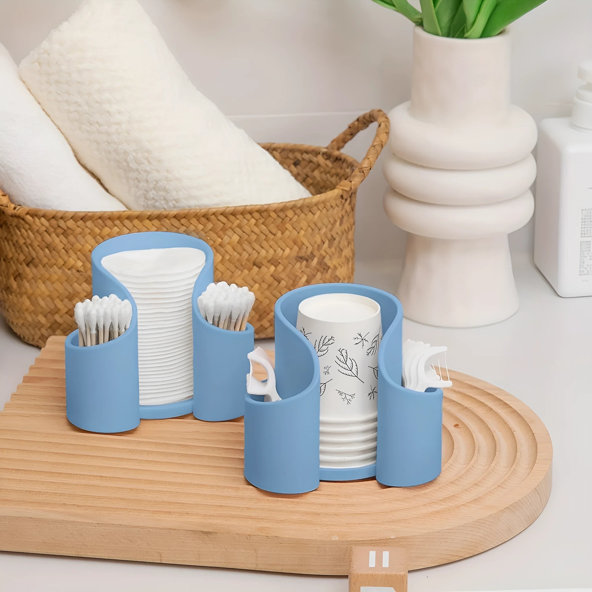 Modern plastic dental floss storage box in solid colours pink, white, blue, and black