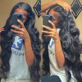 Black long curly synthetic front lace wig with side bangs, made from high-temperature fibre.