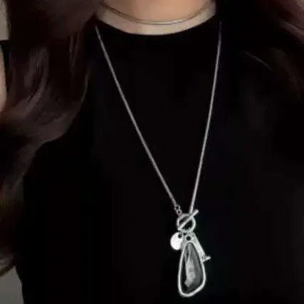 Long alloy snake bones chain necklace with a geometric plaid pendant for women