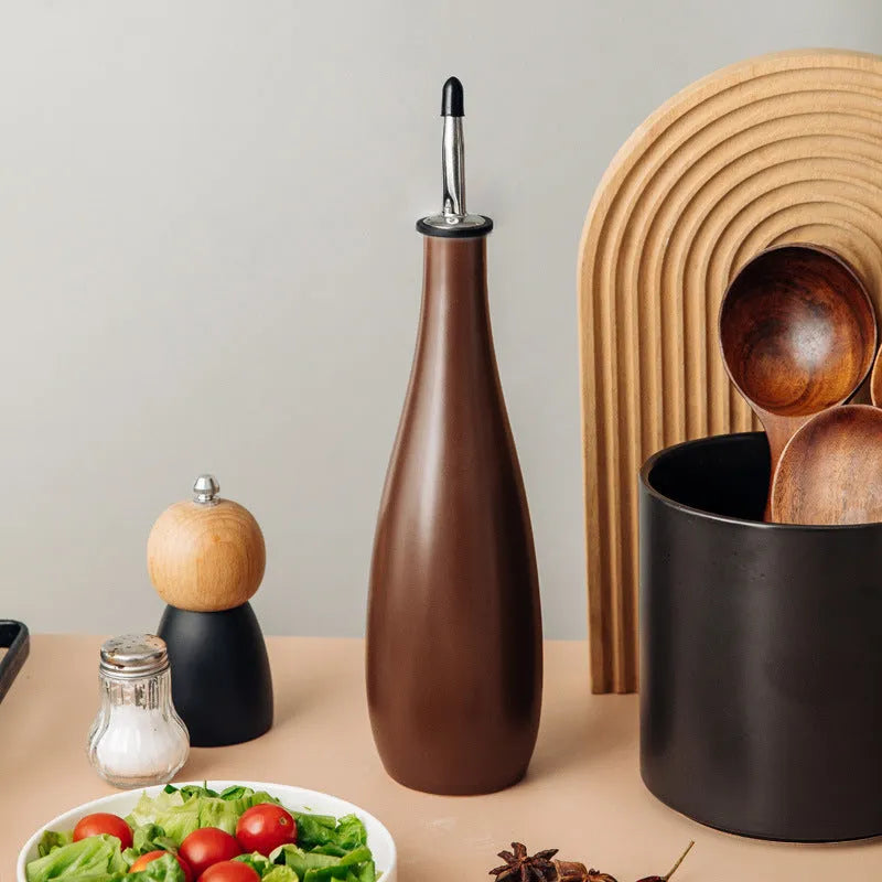 Ceramic kitchen oil pot with funnel and brush in black, coffee, or white colour, 650ml capacity.
