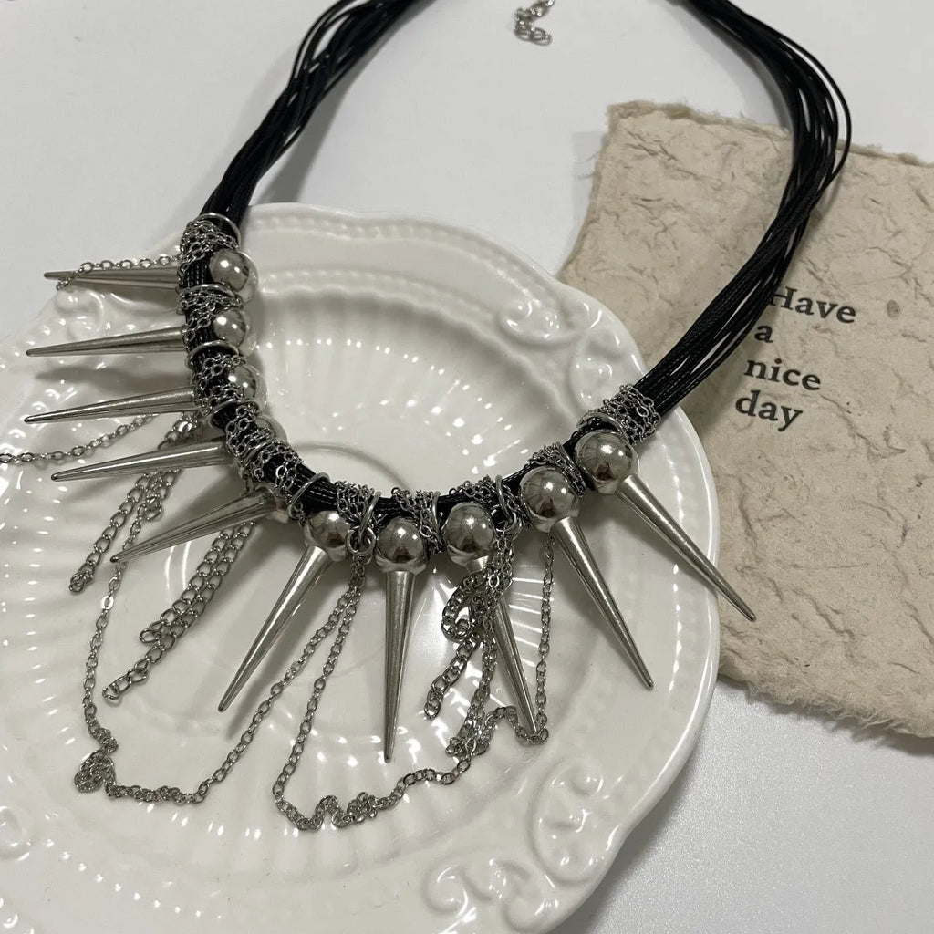Rivet round beads winding tassel necklace with leather cord and electroplated details