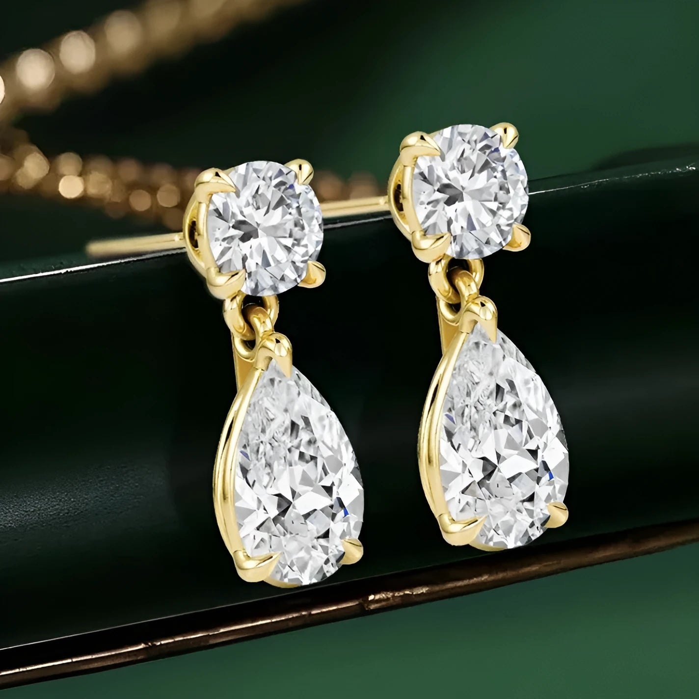 Women's geometric moissanite stud earrings with round and water drop stones in 925 sterling silver