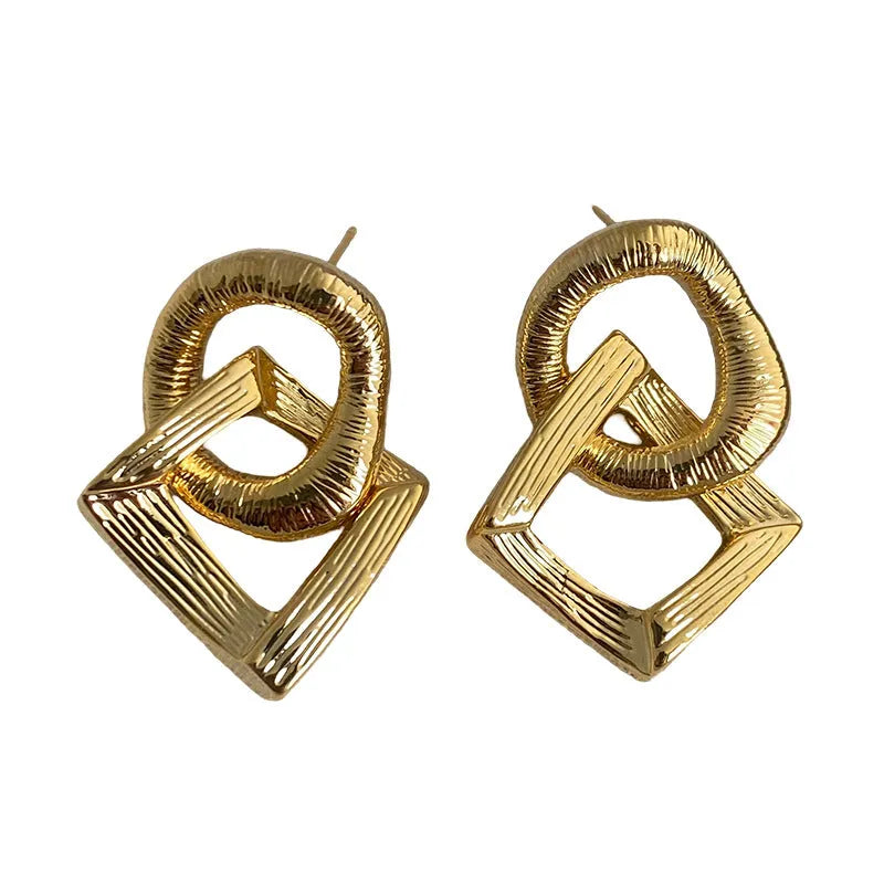 A pair of retro-style geometric circle pendant drop earrings with a 3.4cm length in a gold electroplated finish.
