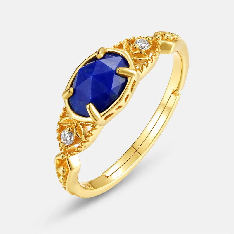 Japanese geometric silver ring with elliptical face and round lapis lazuli stone showing forest night sky colour
