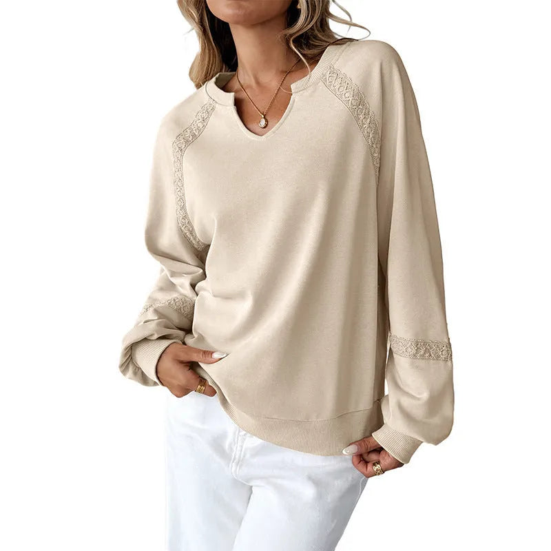 Women's loose fit long sleeve sweater with a half-open collar featuring lace stitching detail, shown in a solid colour.