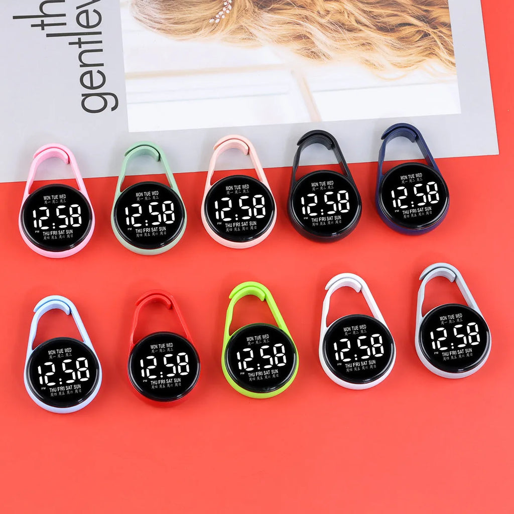 LED digital watch with luminous display and plastic strap in one of ten colour options on a wrist.