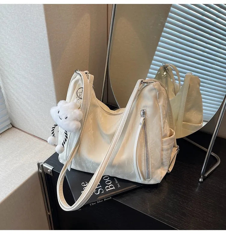 Women's soft PU backpack in four colour options with matching pendant