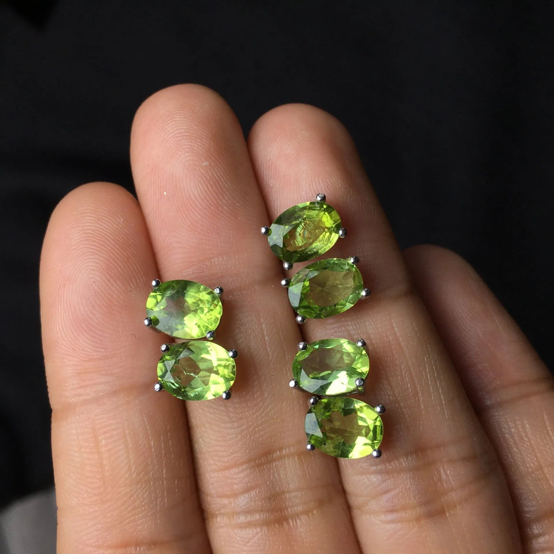 Natural grass green olivine stud earrings in S925 sterling silver with 6×8mm elliptical faceted gemstones.
