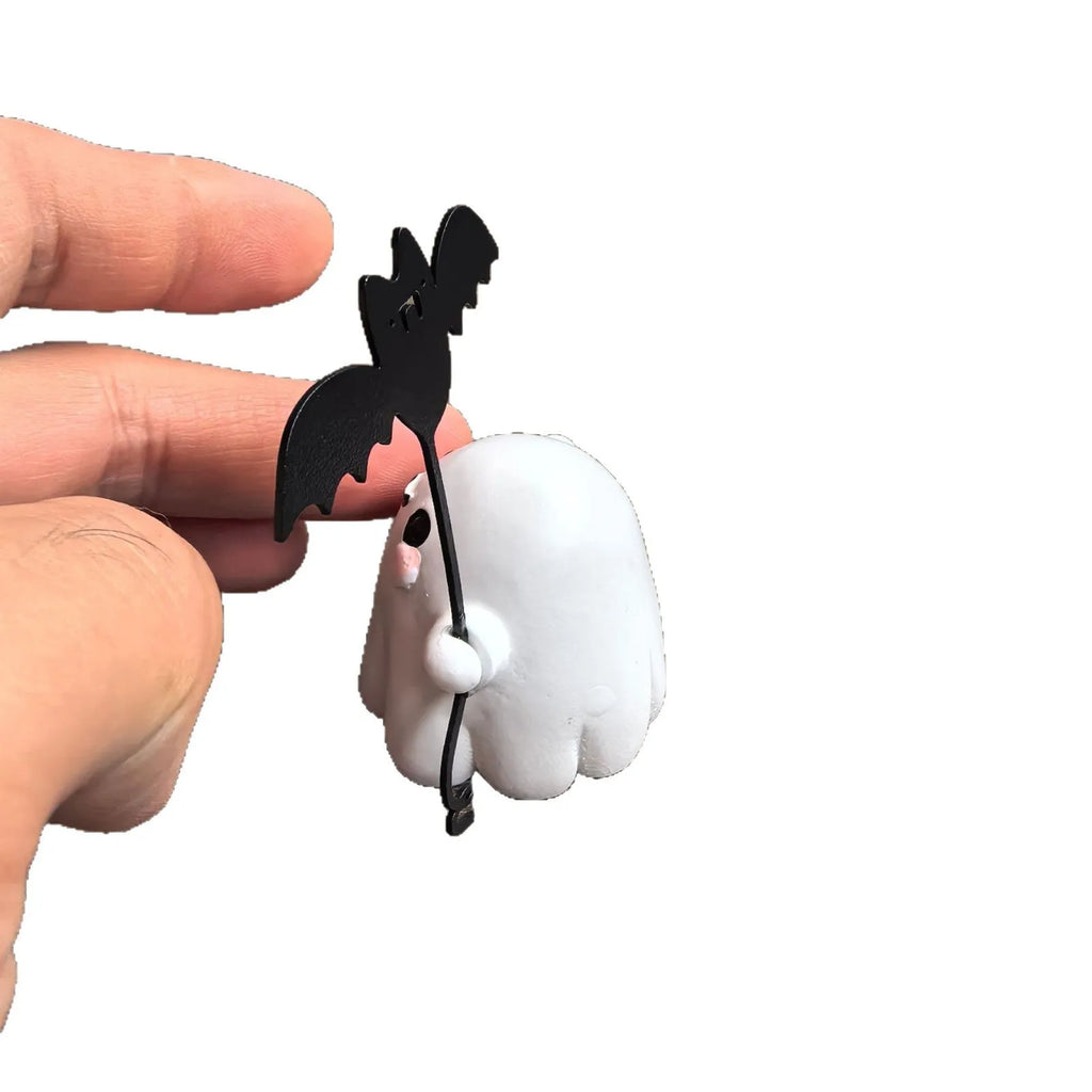 Miniature resin ghost statue walking a dog and holding a bat, Halloween decoration