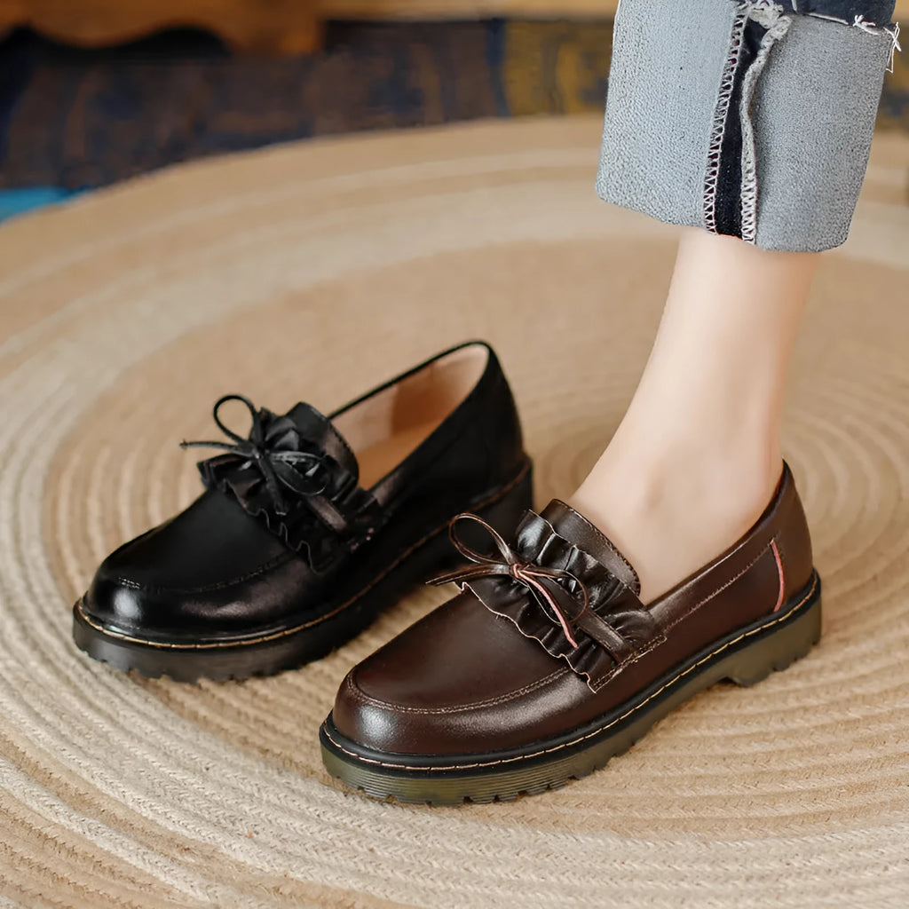 Black British style women's leather shoes with chunky heel and round toe on a white background