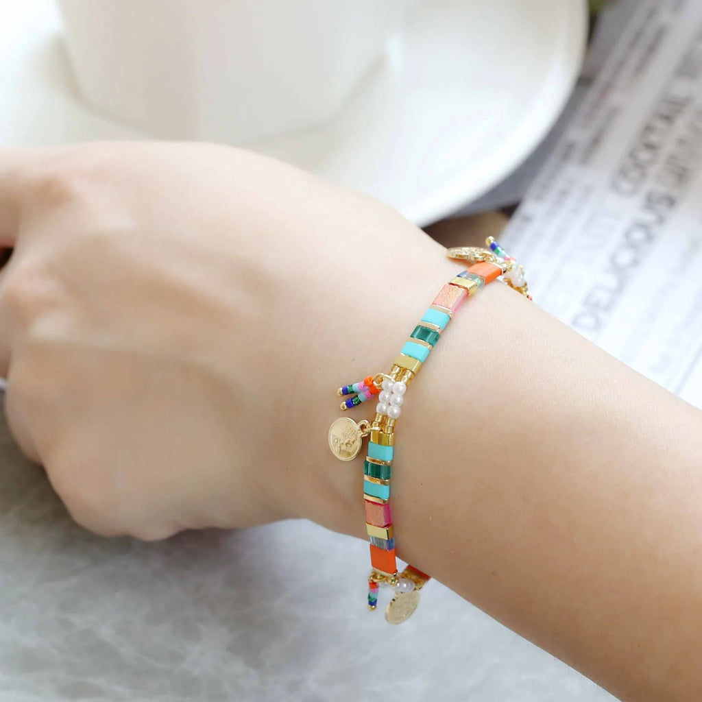 Women's imitation pearl beaded bracelet with glass coloured detailing in pearl lift colour options