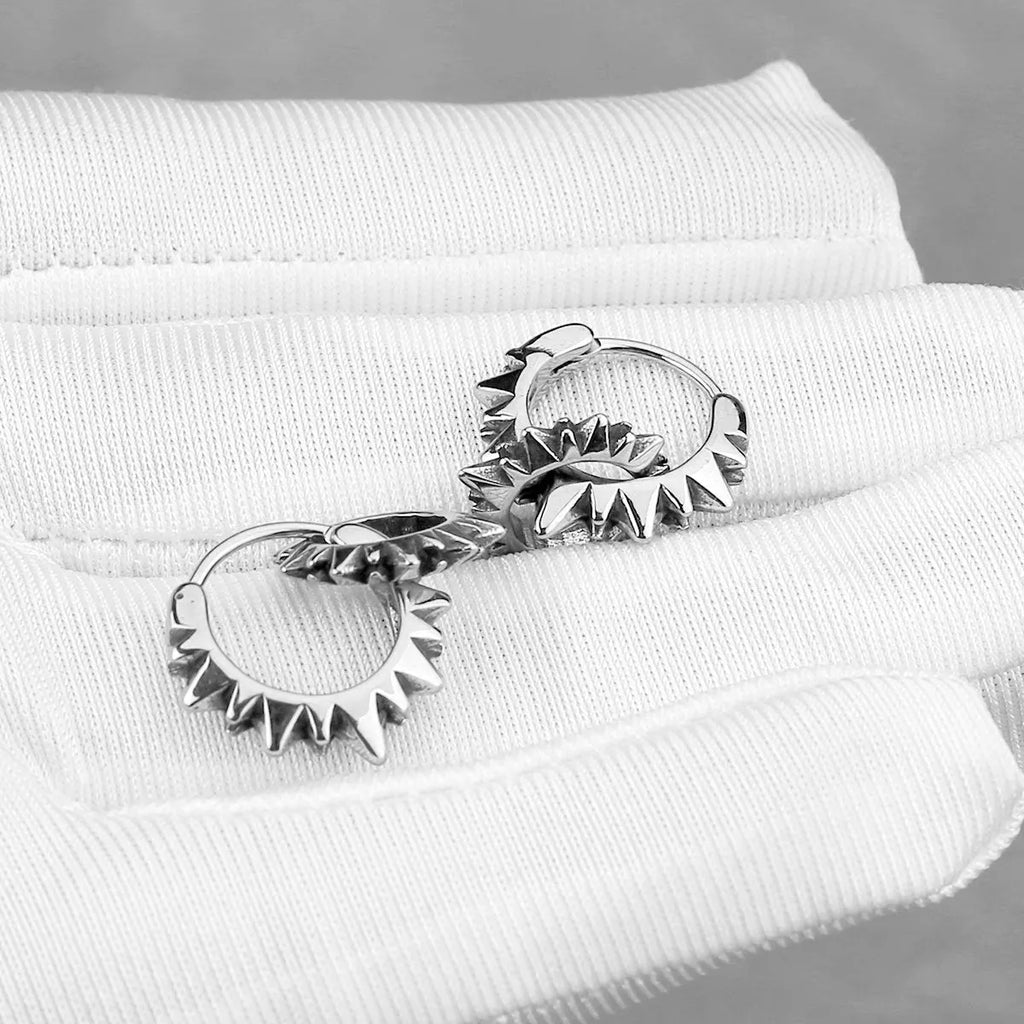 Polished stainless steel round ring earrings in retro style with steel colour finish