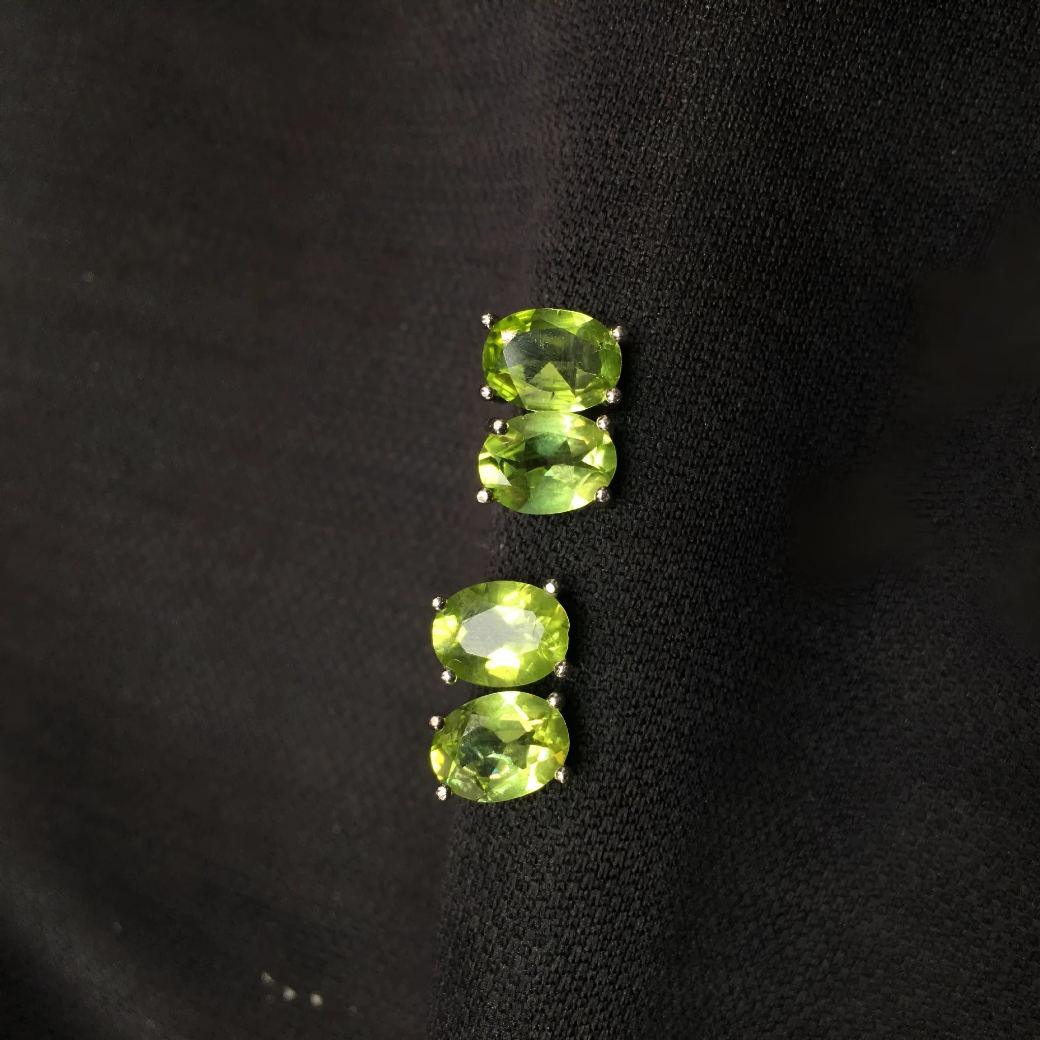Natural grass green olivine stud earrings in S925 sterling silver with 6×8mm elliptical faceted gemstones.