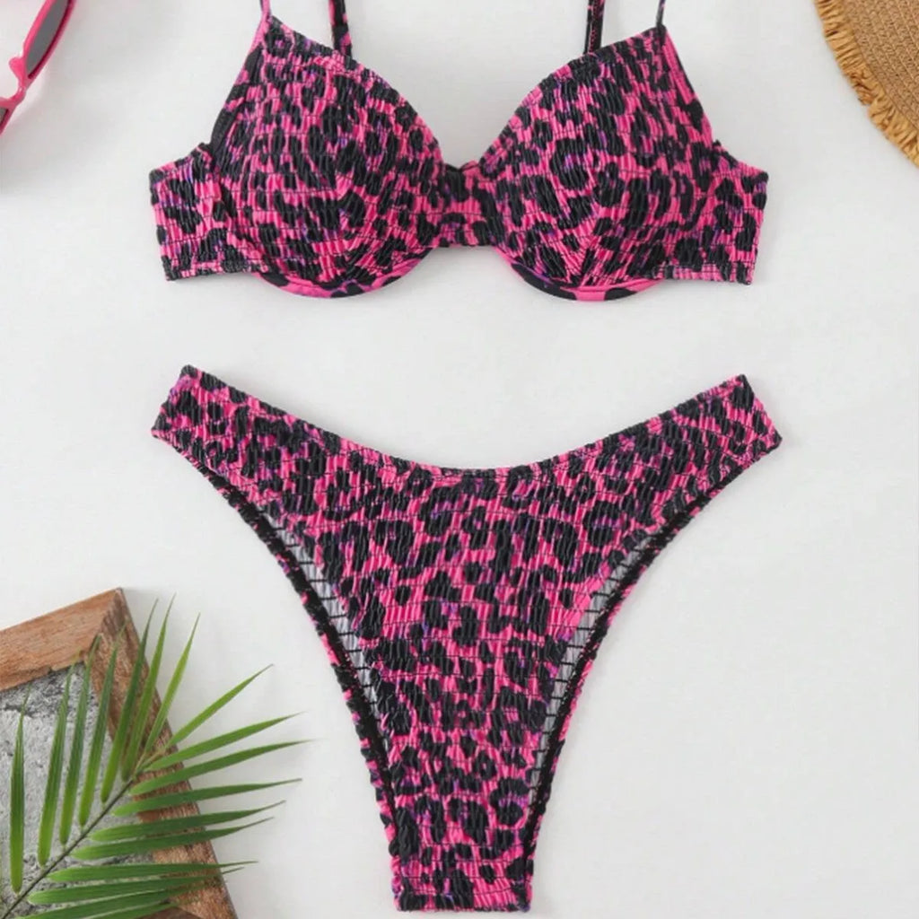 Women's leopard print bikini set with backless triangle top and briefs in brown and red colour mixes.