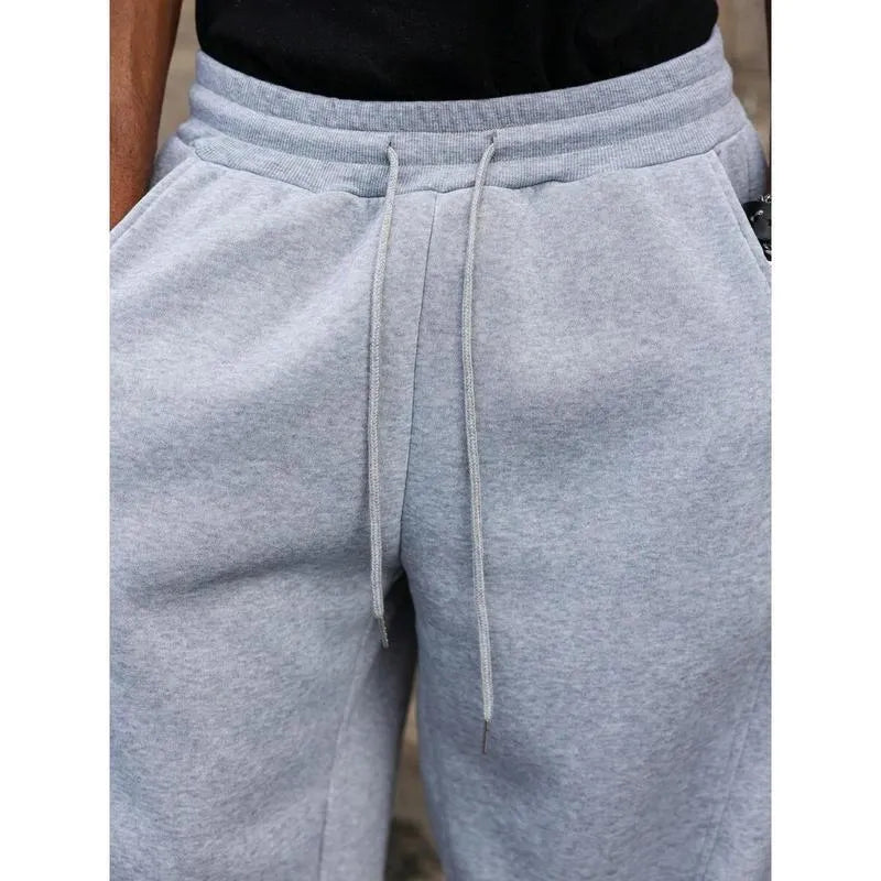 Men's high-waist straight-leg trousers in bamboo blend fabric showing cropped length and elasticated waist
