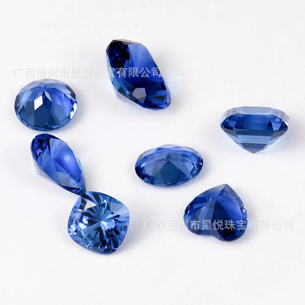 Royal blue loose gemstone in heart shape on a white background for jewellery making.