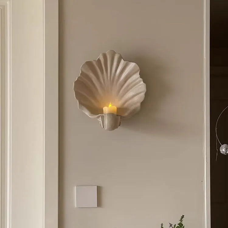 White resin simulation shell storage fruit plate ornament on a plain background.