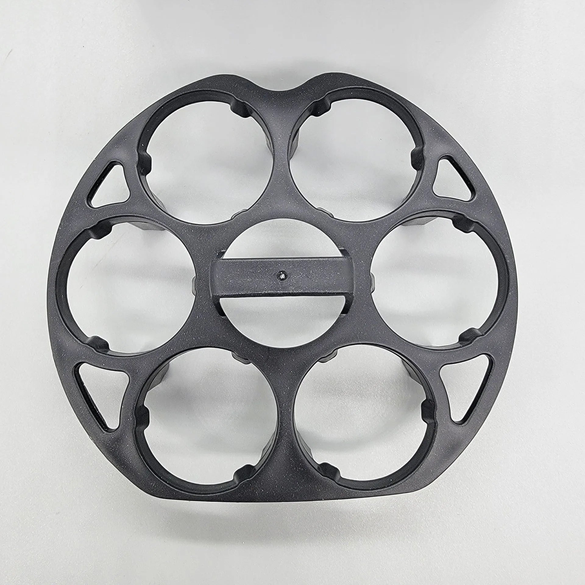 Black plastic egg holder rack with individual compartments measuring 13.8cm wide