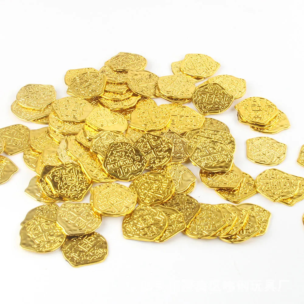 Set of 100 gold, silver and bronze coloured plastic replica Roman coins scattered on a surface.