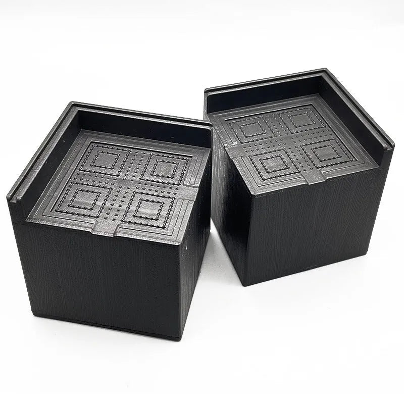 Black plastic furniture foot mat set of four for height adjustment on hard floors