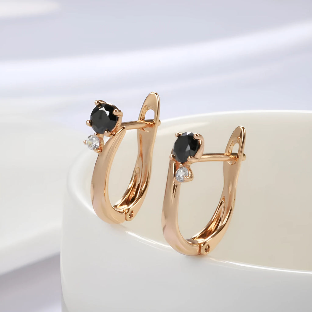 Gold drop-shaped women's earrings with a black agate stone inlay and retro geometric design.