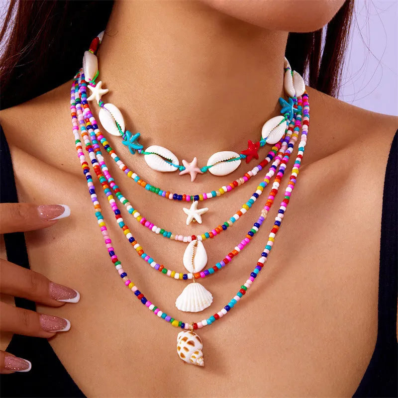 Five multi-layer women's necklaces with shell, starfish and conch beads on adjustable chains
